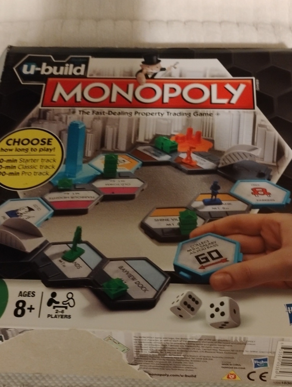 Hasbro Monopoly U-Build Game Box - Black, Red, Blue, Green